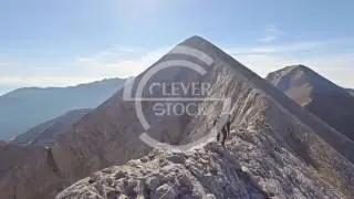Male Backpacker Walking On Edge Of Mountain Cliff Sky Extreme Sport Adventure Landscape Lifestyle