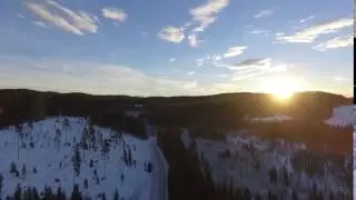 Sunrise above forest & road | Free Drone Footage