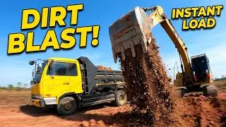 Excavator Loading Dump Trucks &ndash; Perfect Teamwork