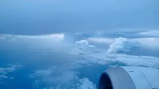 Oman Air Flight, Flying above Clouds, Window Seat View.