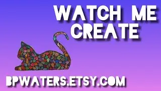 Creating an alcohol ink wall art piece, cat lying down