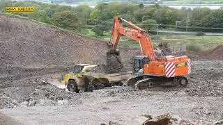 Hitachi Zaxis 670 loading stone on a bypass project