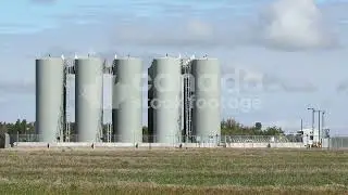 Rural fuel depot. Grey storage tanks stock video. Saskatchewan, Canada. HD Royalty Free.
