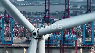 Aerial View Container Terminal - Industrial Cargo Port & Windmill - Economy - 4k Stock Footage