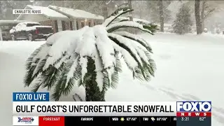 Jason and Ashlyn look through photos and videos of the historic snowfall last year
