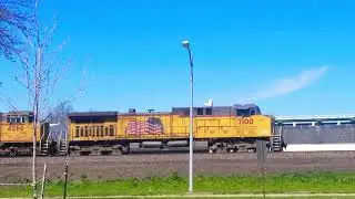 UP 7100 LEADING, 4266, 5054, AND 5867 EASTBOUND ON THE OMAHA SUBDIVISION