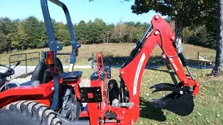 Disconnecting a backhoe attachment on a Massey Ferguson 1835E
