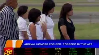 Soldiers carrying Sec. Robredo's coffin out of the plane