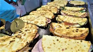 Italy Street Food. Large Flat Bread 'Spianata' Stuffed with Ham, Salami, Cheese and more