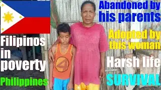 Giving Help to a Filipino Child Who Was Abandoned by His Parents. Poor Filipinos in the Philippines