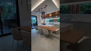 This kitchen was amazing, with an island table, integrated tablebeautiful chairs and modern lighting