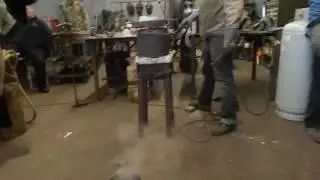 Michael Coffey water casting a copper ingot at Swords Through the Centuries 2016