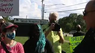 Tense night in Shelby Twp. as protesters were confronted by police, counter protesters