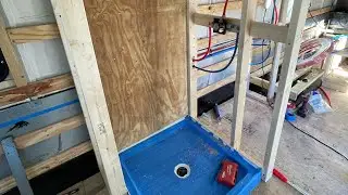 Installing shower pan, mixing valve for shower. Skoolie  converting school bus to tiny home
