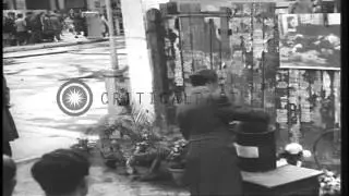 People look at the point where Mussolini and others were hanged after death in Mi...HD Stock Footage