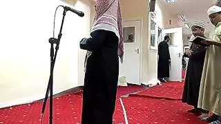 Young boy reads like Mahir Al Muaiqly