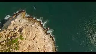 Cliff mountain beach top drone view