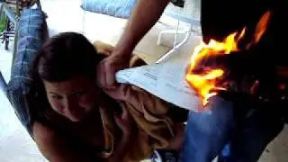 Newspaper fire to ear trick #2