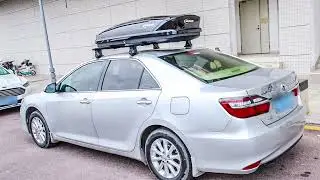 The Peugeot 4008 is equipped with a NEUMANN 307s roof rack and a black G5B roof box.