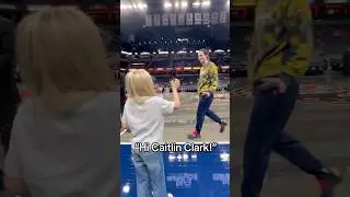 Caitlin Clark with a young fan