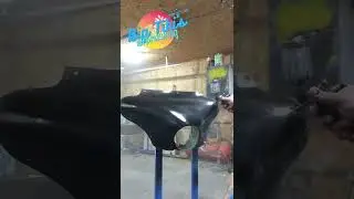 painting a Harley Davidson Fairing black at Big Tiki's Airbrushing
