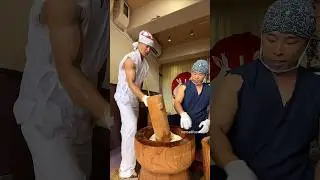 Powerful Kyoto young man pounding mochi - A must-try mochi in Kyoto, Japan