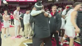 ISU basketball players cheering hard for football