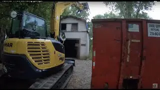 Yanmar SV100 mini excavator demoing garage