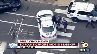 Six police officers shot in standoff