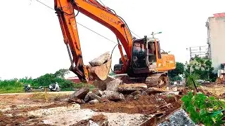 Hitachi excavators demolish concrete roads, excavators scoop up trash along the riverbank.
