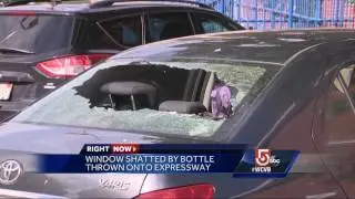 Window shattered by bottle thrown onto highway
