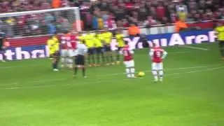 Phil bardsley feels the force of Podolski's free kick