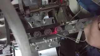 Robot hand adjusting and commissioning on Automatic micro pump assembly machine motor assembly video