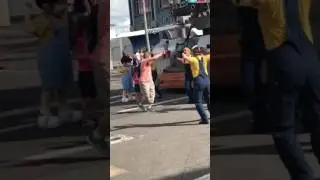 Lady dances with minion parade