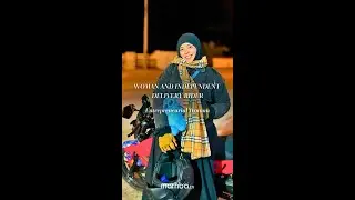 Veiled woman working as an independent delivery driver.
