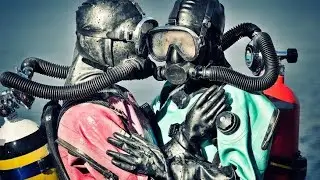 Happy couples are in latex full face gas masks and scuba diving gear dresses