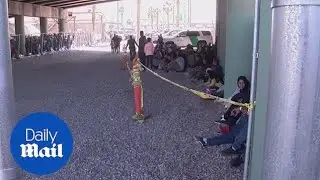 Asylum seekers are held under El Paso bridge