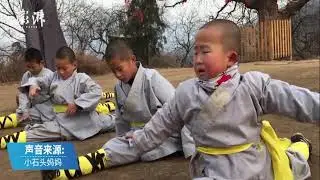 A cute 3-yr-old monk shows off his martial arts skills