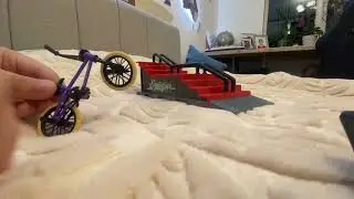 Playing with a Teck-Deck Bmx with a stair and grind rail set!