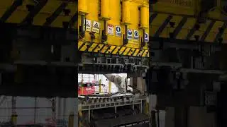 Automated hydraulic press line in the automotive stamping process.