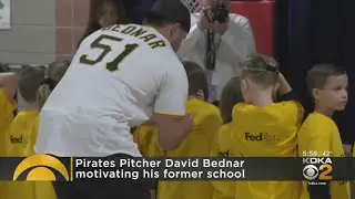 David Bednar delivers baseball gear to old elementary school