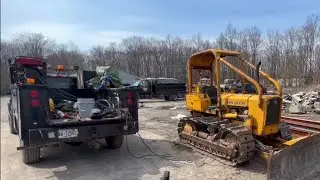 Welding grousers on John Deere 450B dozer