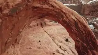 Drone video flying through Corona Arch Moab