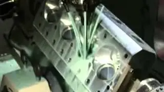 Kauffman Racing Equipment 5 axis CNC Milltronics milling of Pontiac Hemi Head with Troy Key table