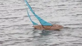pond yacht trial run in good breeze