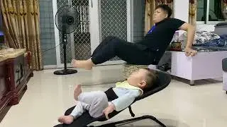 FATHER AND FUN: Adorable Moment Baby Copies Dad's Workout Routine