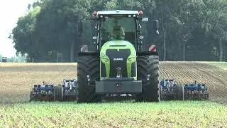 Claas Xerion 4000 with K&ouml;ckerling Vector 8m cultivator coming close on German farm