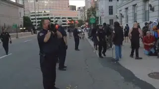 RAW VIDEO: Police struggle to control crowds outside the Denver Mint