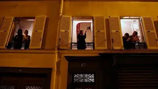 Residents in Paris applaud health care workers from their windows
