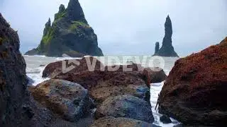 Rock Formations And Basalt Sea Stacks At Reynisfjara Beach In Southern Iceland